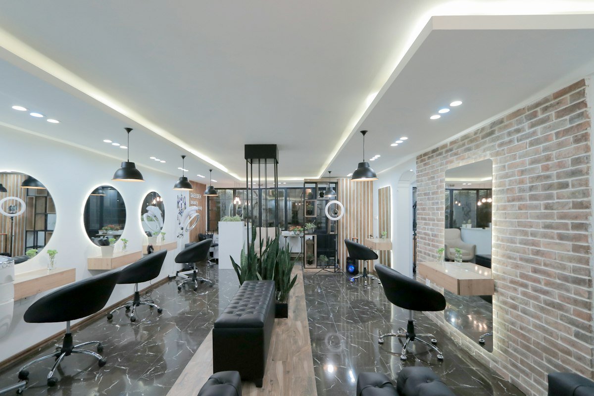 Modern salon styling stations with round mirrors